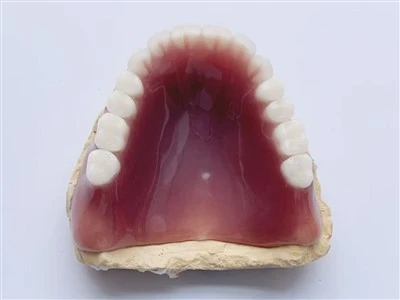 Denta acrilico completo della gomma scura in porcellana